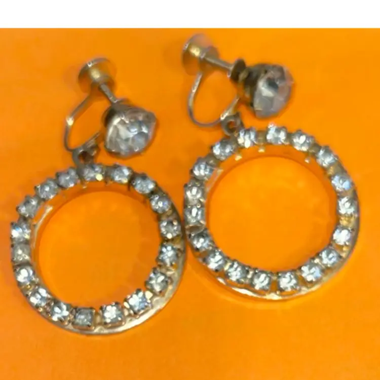 Vintage Signed Coro 60s Rhinestone Screw Back Hoop Earrings Set in Gold Metal.