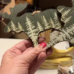 Two wooden moose ornaments