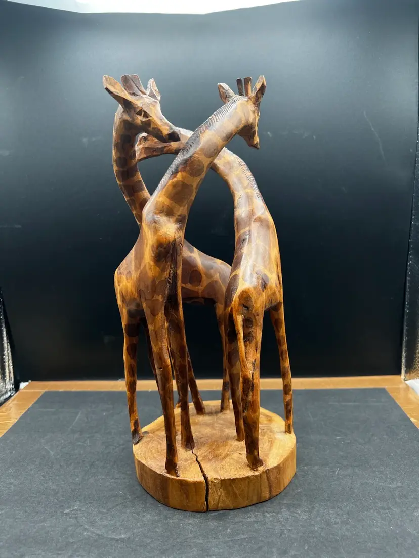 #2009B Beautiful Vintage Hand Carved Sculpture Of 3 Giraffes In A Circular Formation.
12β Tall X 6β Wide, African Souvenir - Marked Made In Kenya On Bottom.
In Very Good Condition. No Issues.