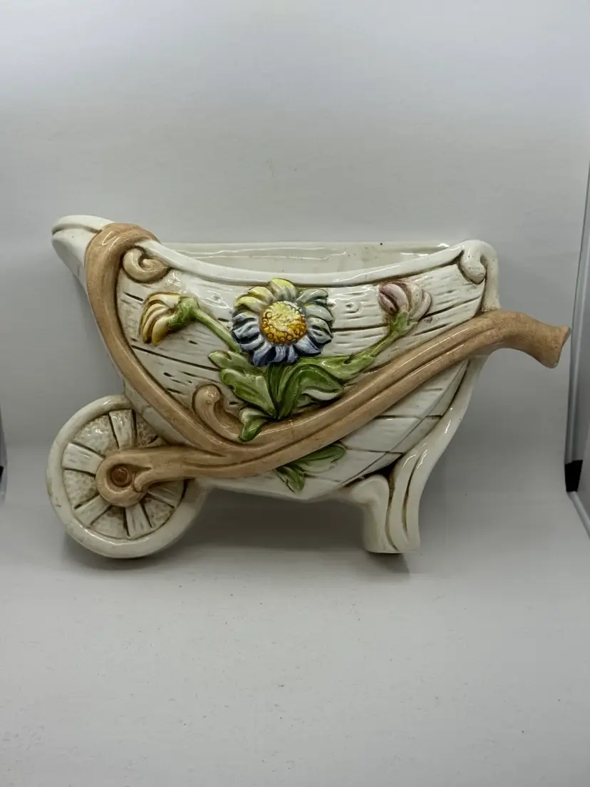 Hand-painted Italian ceramic wheelbarrow wall planter with floral motif, 10”x8.5
