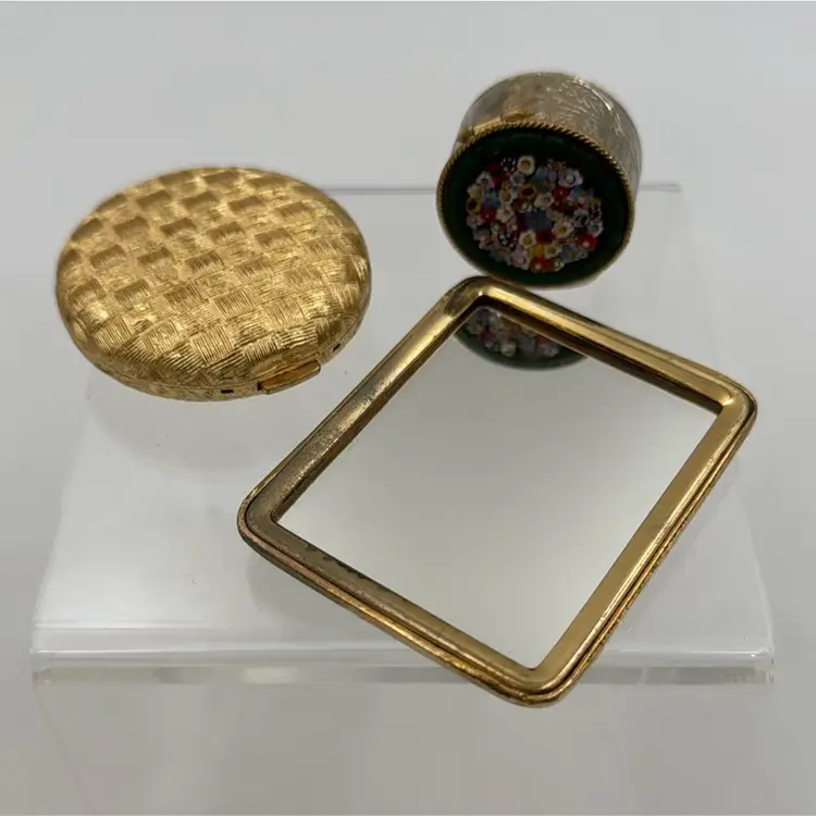 A set of three vintage cloisonne a peacock brass mirror, micro mosaic pill box Revlon love Pat press powder, compact