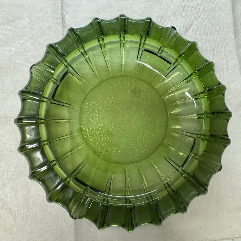 Vintage emerald green ribbed glass ashtray with a scalloped rim, 10” And Heavy!