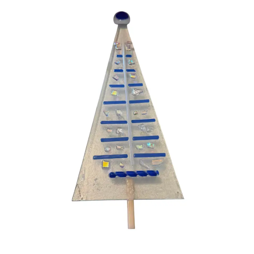 handmade fused glass Christmas tree ornament typically used for holiday home decoration