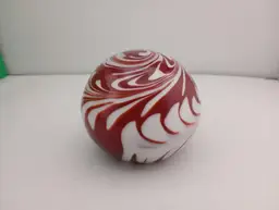 Vintage red and white swirl paperweight