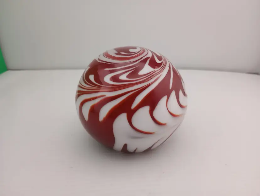 Vintage red and white swirl paperweight