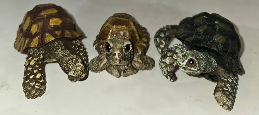 Three Adorable Turtles 2 and 3 inches see pic for one that lost his leg. Resin I believe.