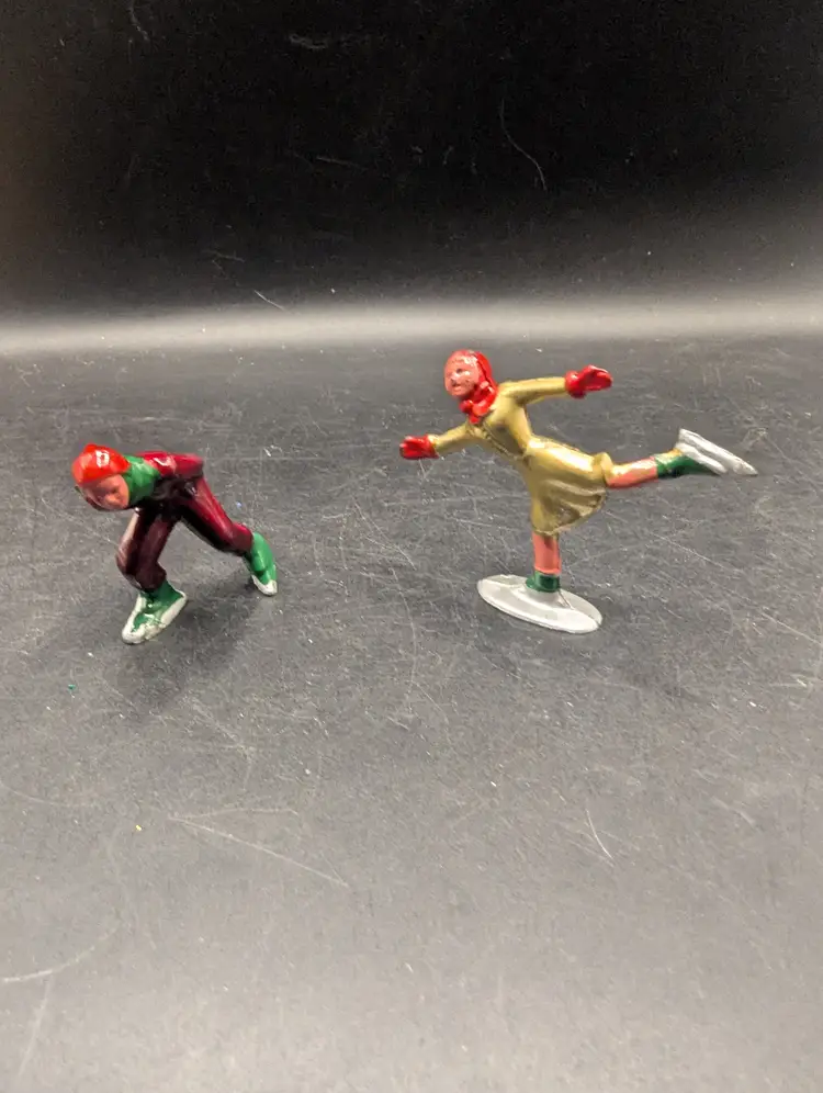 Vintage Set of 2 Barclay Type Metal Hand Painted Skaters Boy and Girl.