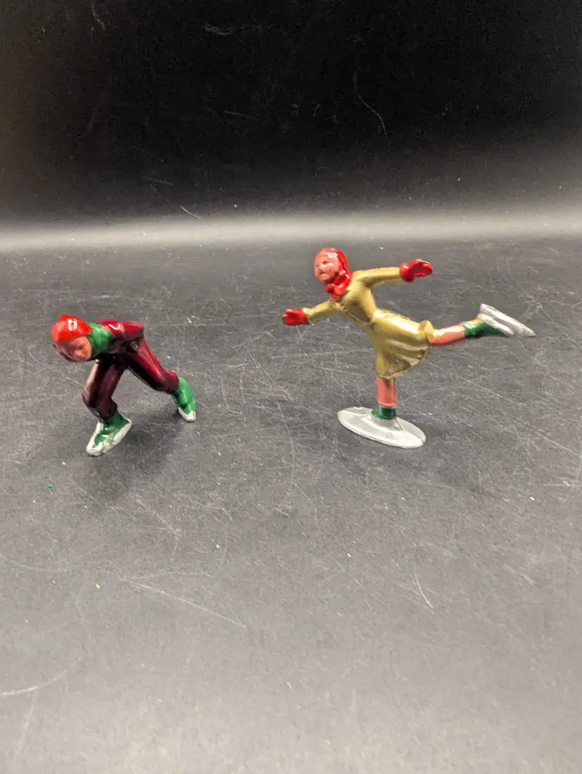 Vintage Set of 2 Barclay Type Metal Hand Painted Skaters Boy and Girl.