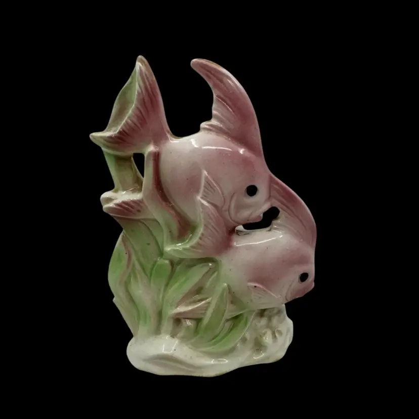 Vintage pink and green ceramic figurine of two intertwined fish.