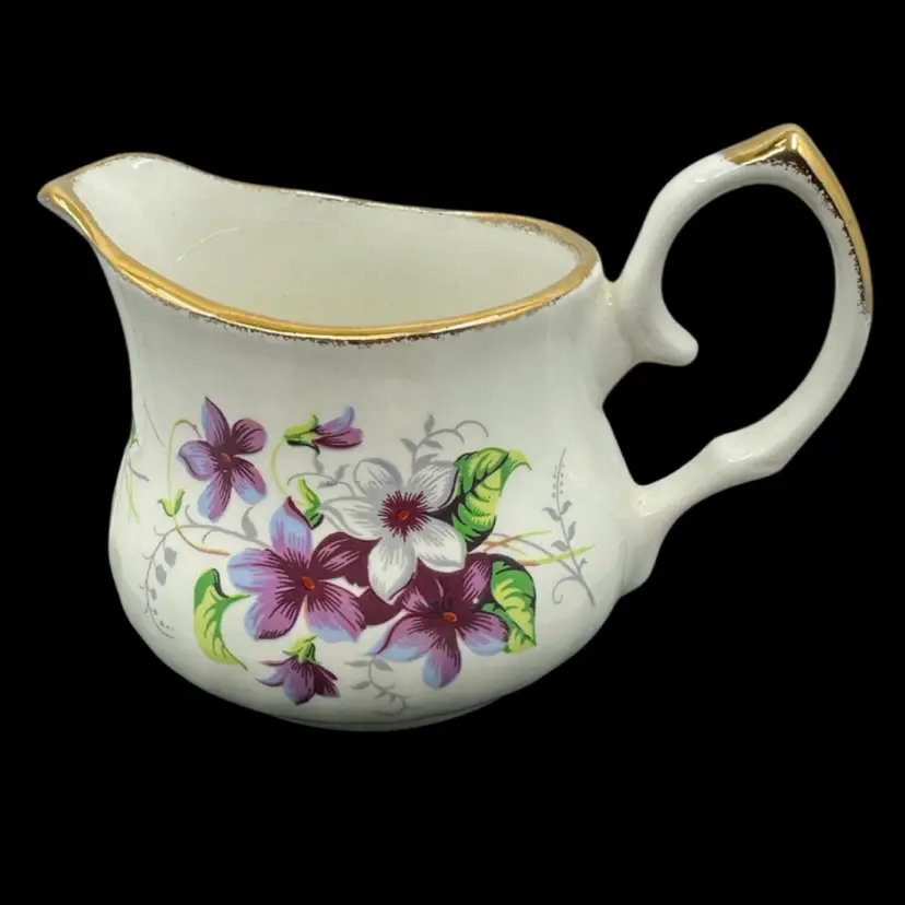Vintage Crown Staffordshire floral creamer with gold trim.