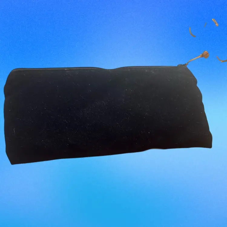 Vintage Mary Kay makeup bag featuring a distinctive gold rose design on black velvet.