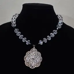 # 004 Multi Faceted Clear and Black Glass Beads W7th White Plique-a-Jour Enameled Floral Pendant