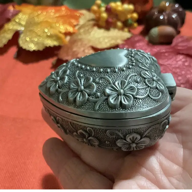 Beautiful Silvertone Trinket Heart Box. Blk Velvet Like Lined Material. Floral Flower Design And Heart Outline In Center Of Lid. Great For Rings . Earrings . Little Trinkets, Coins Etc.