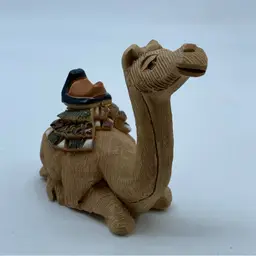 #3047 Handcrafted Artesania Rinconada ceramic camel figurine with painted details.
