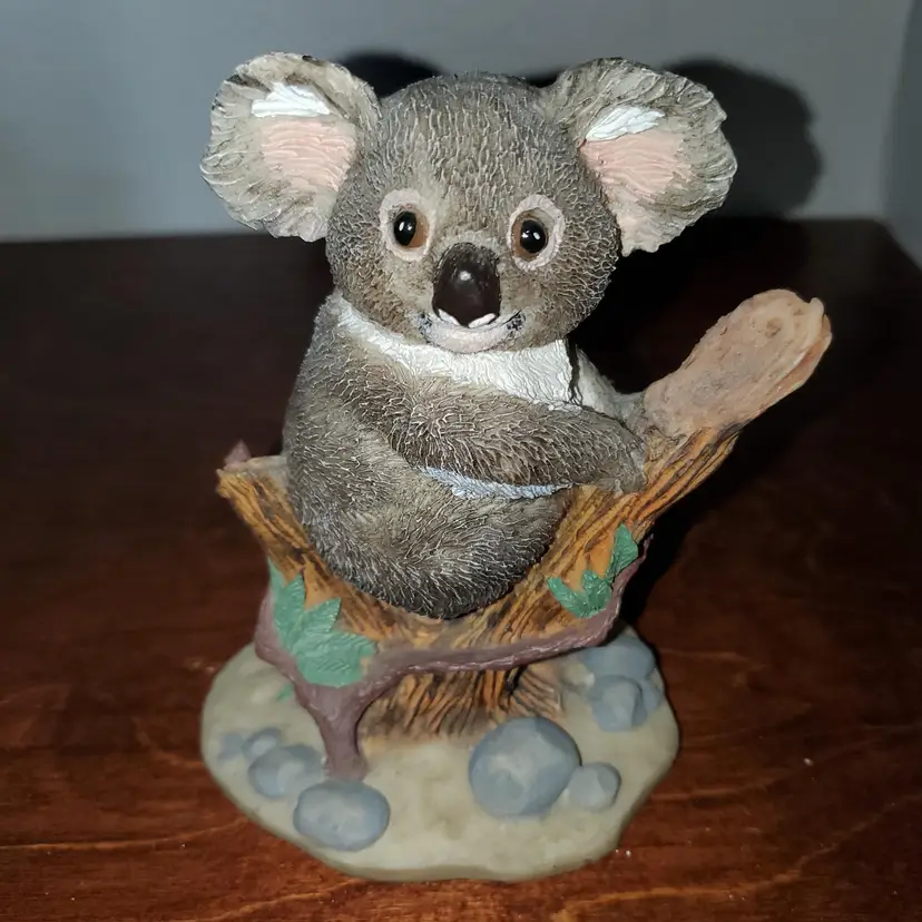 Adorable Koala Figurine on Tree Branch