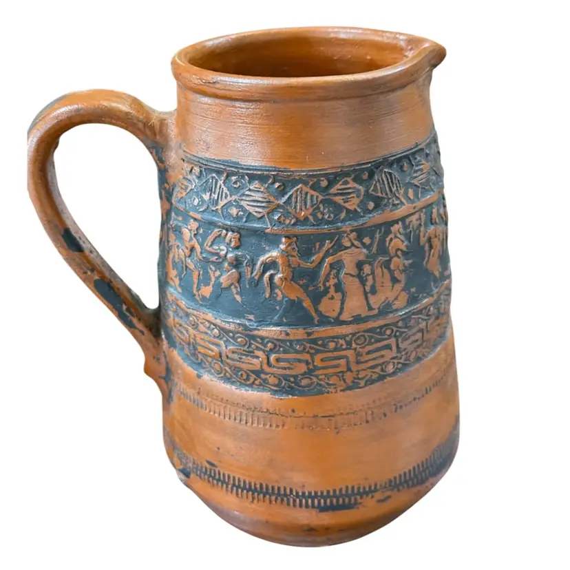 terra cotta pottery pitcher, handmade in Greece, featuring intricate relief decorations