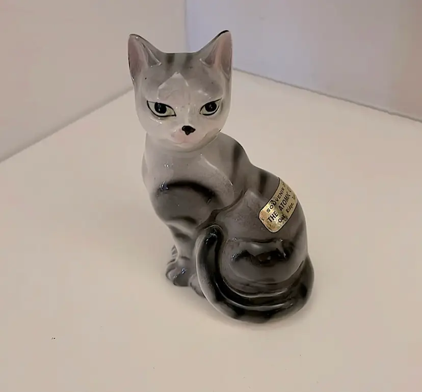 Ceramic, gray/black tabby cat figurine. Light green eyes and a pretty face! Excellent condition! Souvenir of The Atomic City in Oak Ridge, Tennessee