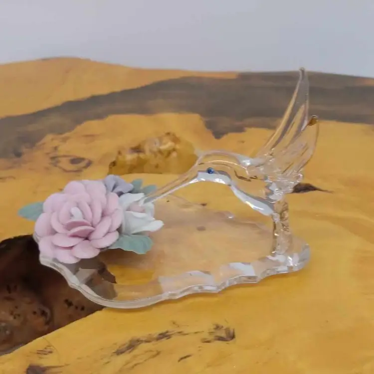 Blown glass hummingbird, porcelain flowers, prism, figurine