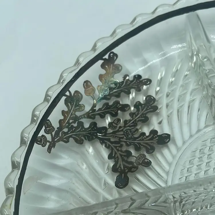#0817 Vintage clear glass divided dish with acorn and oak leaf silver
overlay.
