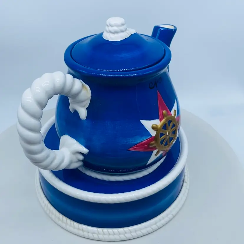 #1826 Three piece Nautical themed tea pot with lid, on matching stand. 1999 by George Z Lefton