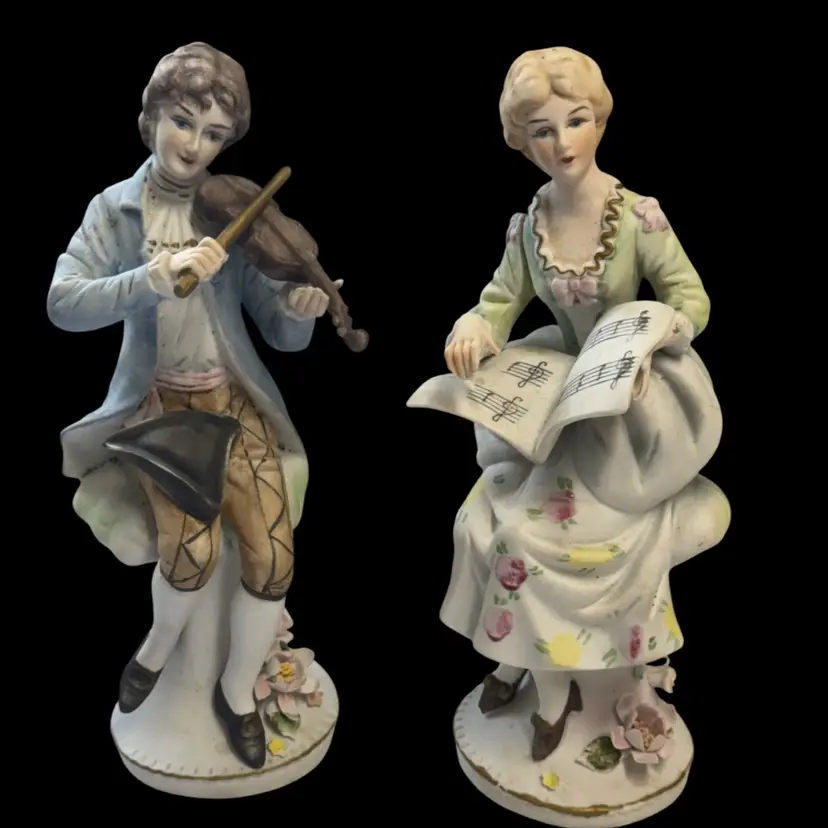 Vintage Pair of decorative porcelain figurines depicting musicians.