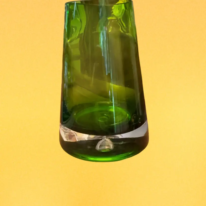 Vintage green tapered vase is a hand-blown art glass piece from Krosno, Poland, featuring a distinct bubble drop at the base. 7.25” Tall No Chips Or Cracks