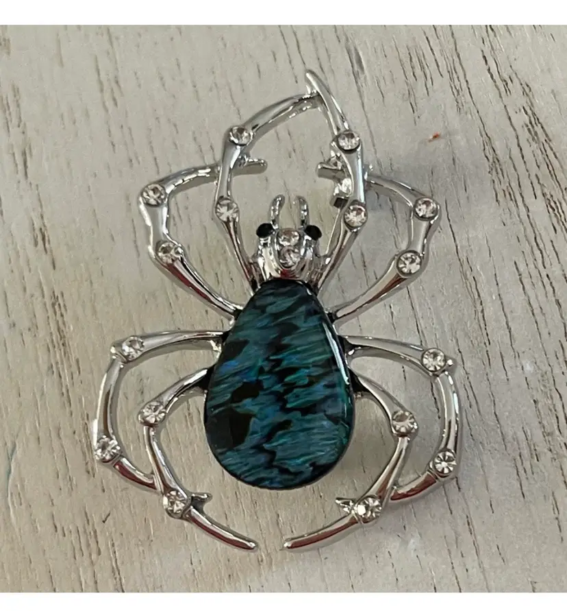 Blue and black spider brooch with clear CZ stones