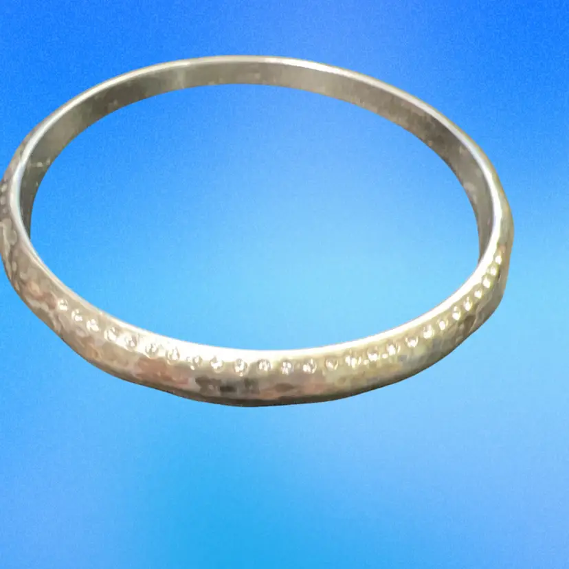This is a Brighton silver-plated bangle bracelet Featuring Tiny Crystal Accents