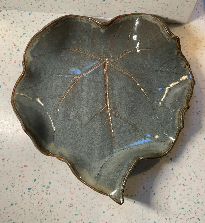 #01 Panthertown Pottery leaf-shaped dish / display piece in soft bluish green glaze 13” x 12.5” and 2.5” tall where leaf sides curl up