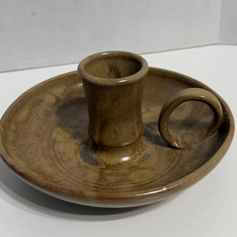 North Carolina Pottery Candlestick Holder With Finger Loop Signed. 3”x6.25”