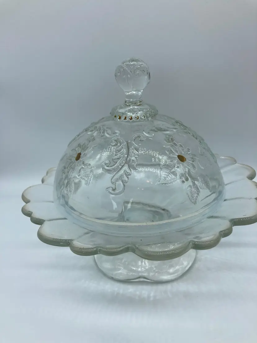 Northwood "Encore" Jewel and Flower Canary vaseline glass butter dish, circa 1905. These types of dishes were common in the early 1900s and were made to hold butter or candy while keeping it fresh.