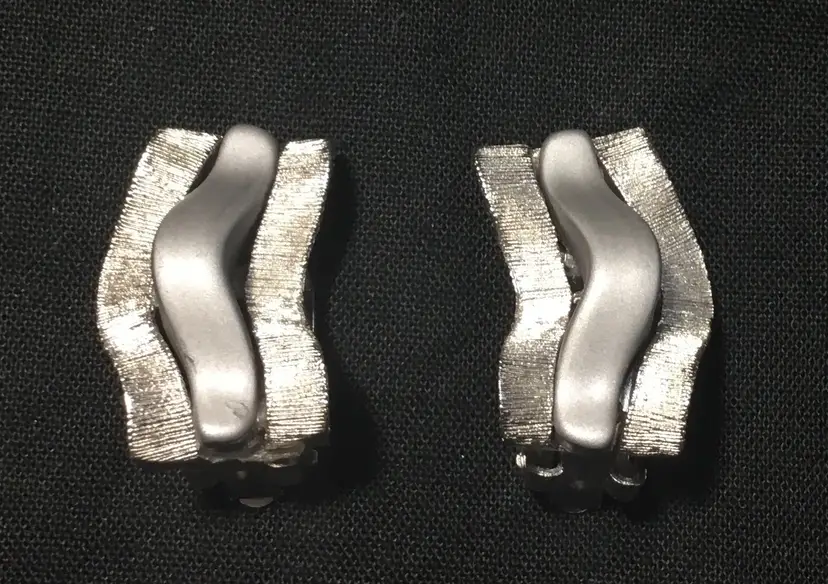 Earrings, MCM silver tone clip on waves, textured & matte