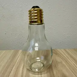 Large Light Bulb Shaped Clear Glass Jar With Gold Tone Screw Top Cap 7” Tall