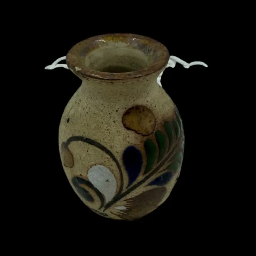 Small hand-painted Mexican Tonala sandstone pottery vase with floral motifs.