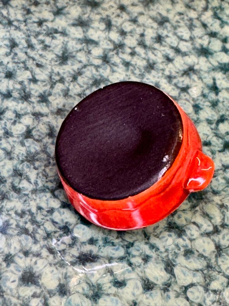 1 inch Mini miniature Le Creuset cocotte, also known as a mini Dutch oven.