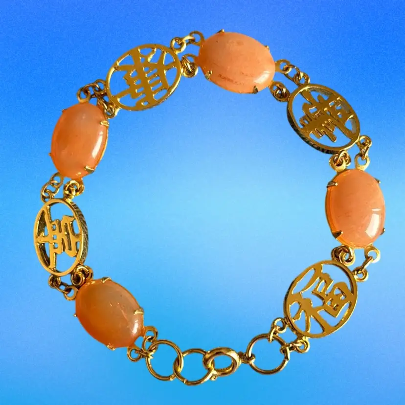 Vintage Peach  Oval Cabochons And Gold Tone Medallions Bracelet.