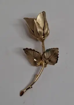 Gold tone rose pin
