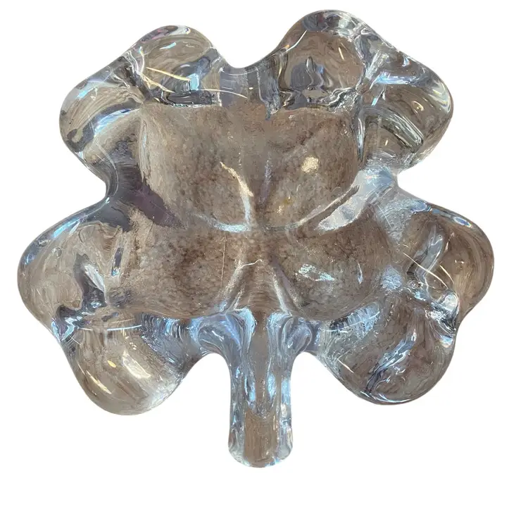 vintage clear crystal glass bowl, often shaped like a four-leaf clover or a flower, which was produced by companies such as Mikasa or sold as a catchall trinket dish