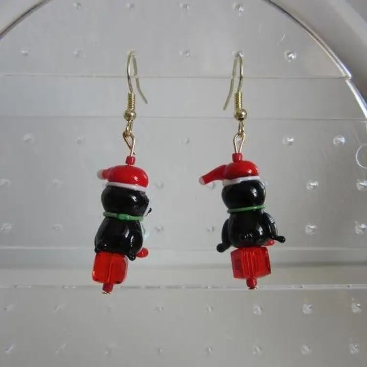 Handcrafted Lampwork glass Christmas Penguins sitting on red present earrings