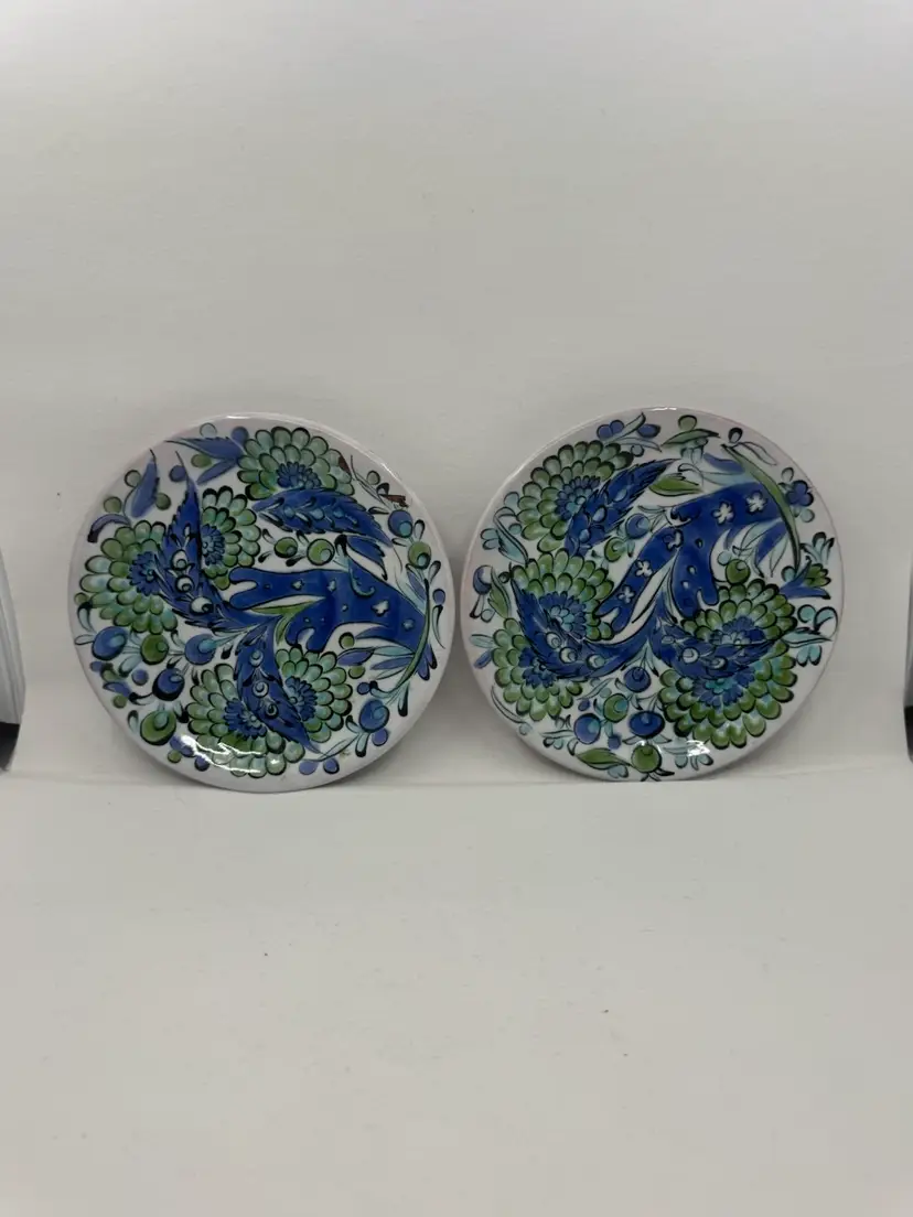 A pair of hand-painted ceramic plates in Iznik style by Ikaros Pottery- Rhodes, Greece