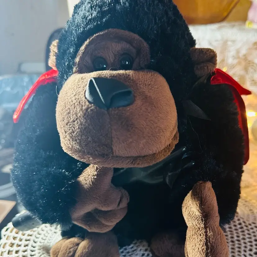 14.  Black Gorilla in Red Cape carrying a pitchfork.