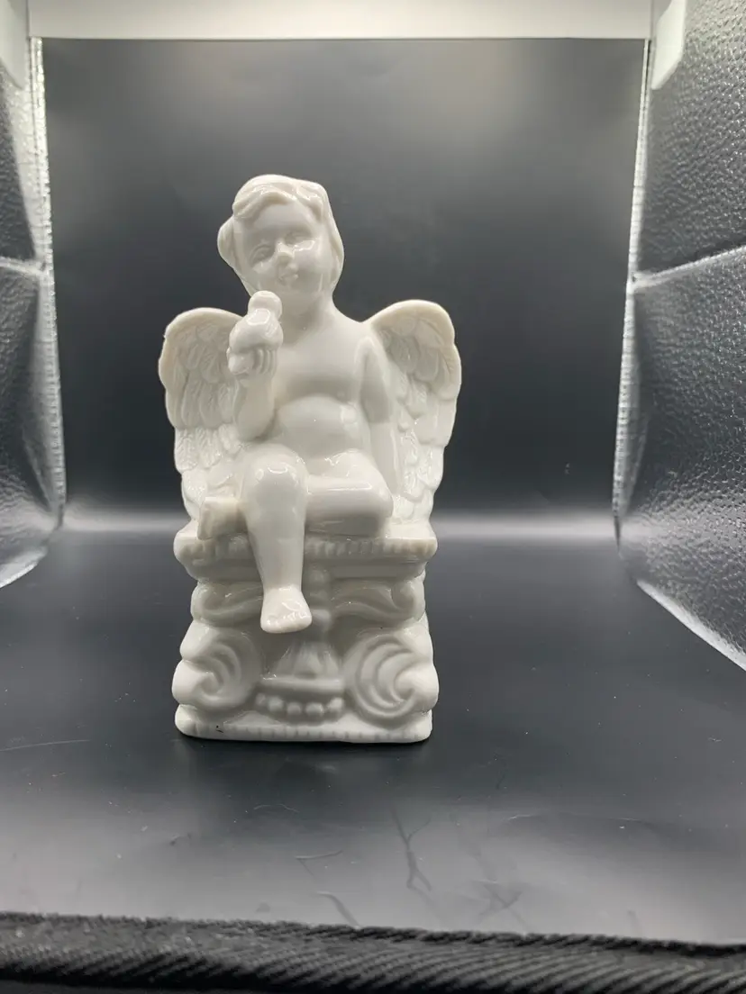 White Cherub w/ Bird Figurine H: 5 1/2” L: 3” W: 3 1/4” It Has A Bird