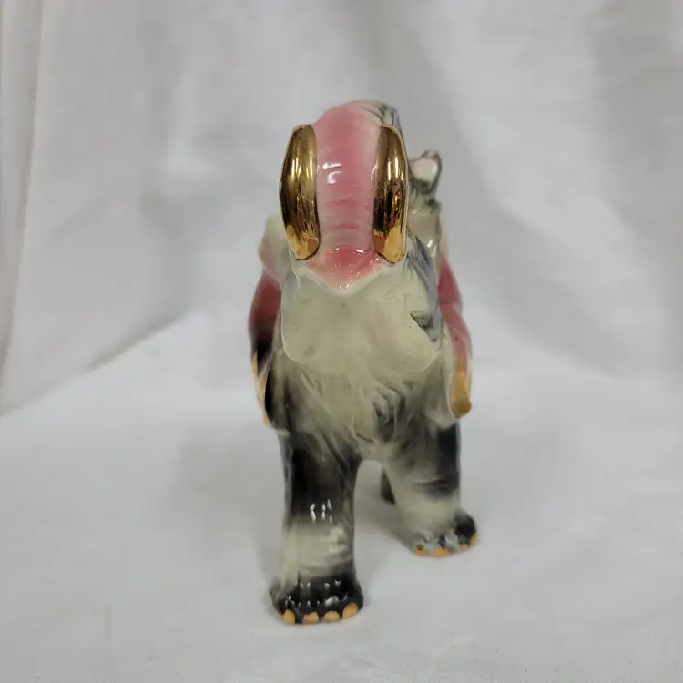 Trunk up elephant figurine with gold detail