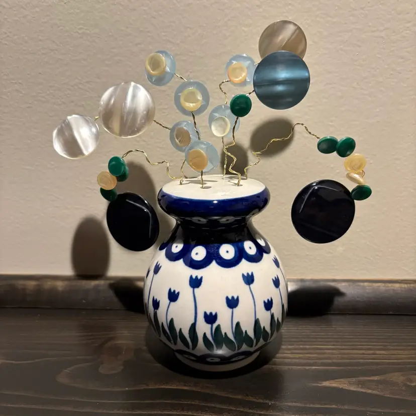 Button Bouquet Made By Me. Polish Pottery Shaker With Tulip Pattern. Plastic Buttons Opalescent Finish.
