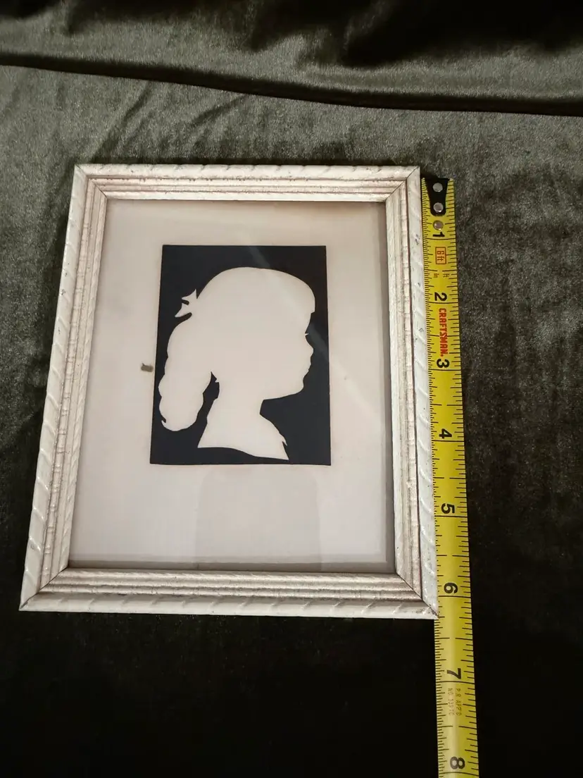 Vintage child/girl Silhouette ~5.25”x6.26” Framed in a White wooden frame