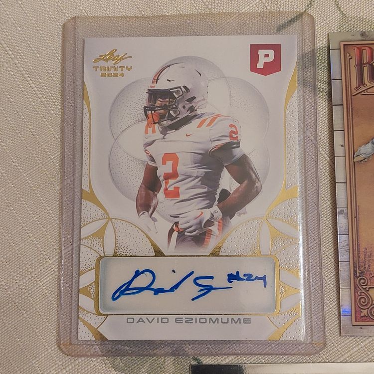 Lot of 7 College Football cards. David Eziomume auto, +. Letter E.