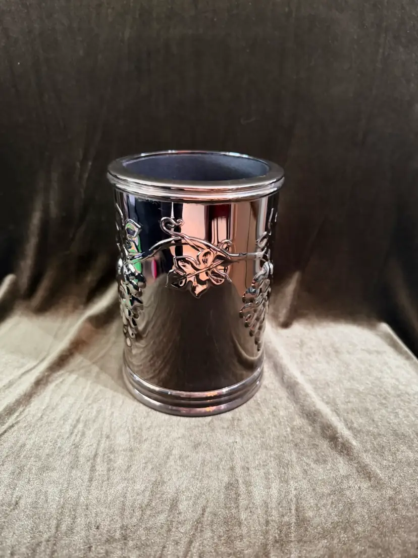 Vintage Godinger Silver Art Co. silver-plated wine bottle cooler or coaster, featuring an embossed grape and vine motif with an insulated liner.