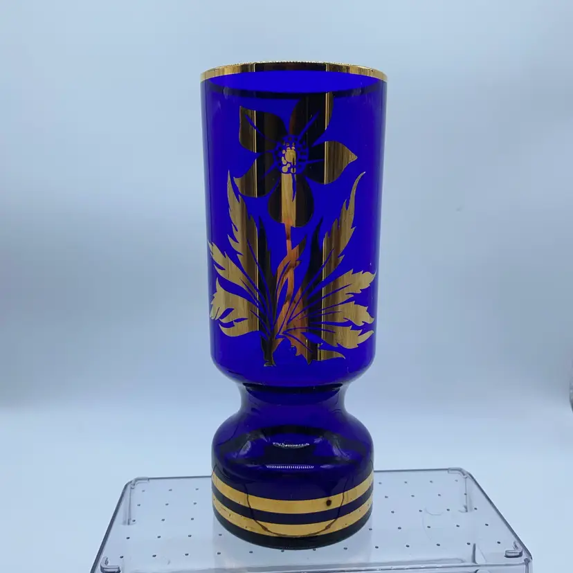 #0203 Vintage cobalt blue glass vase with gold floral overlay and banded base.