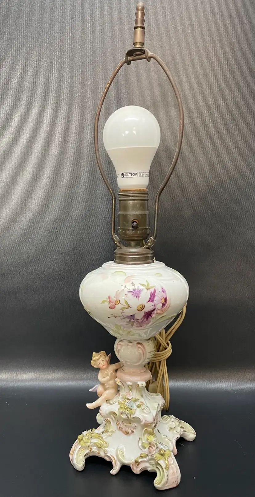 Antique Porcelain Lamp With Cherub And Handpainted Flowers. 