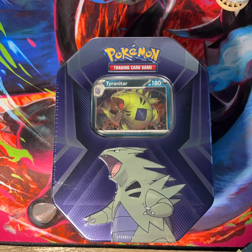 Pokémon TCG Triple Whammy Tin featuring Tyranitar